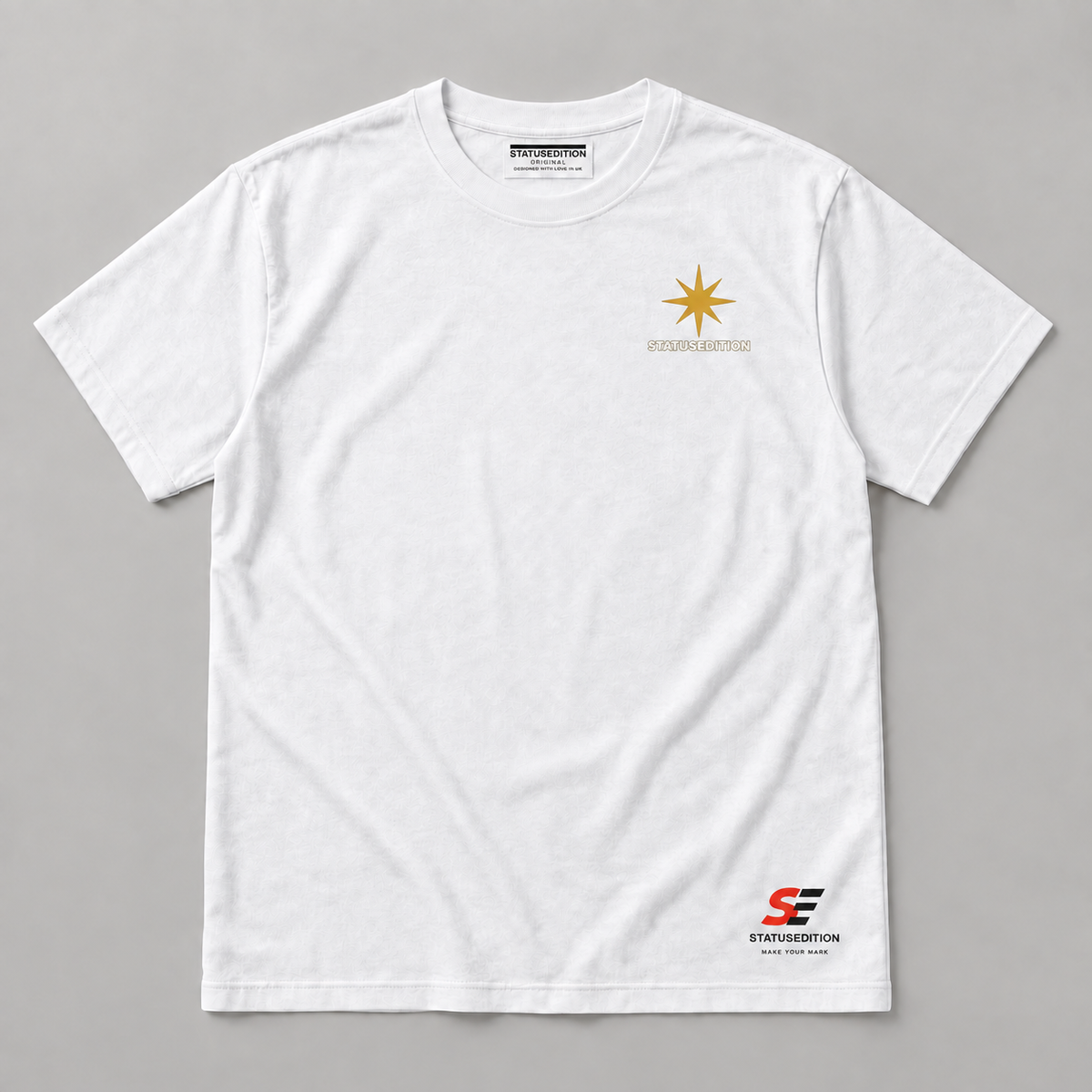 Spark A Kinder World Tee — white front with star chest logo